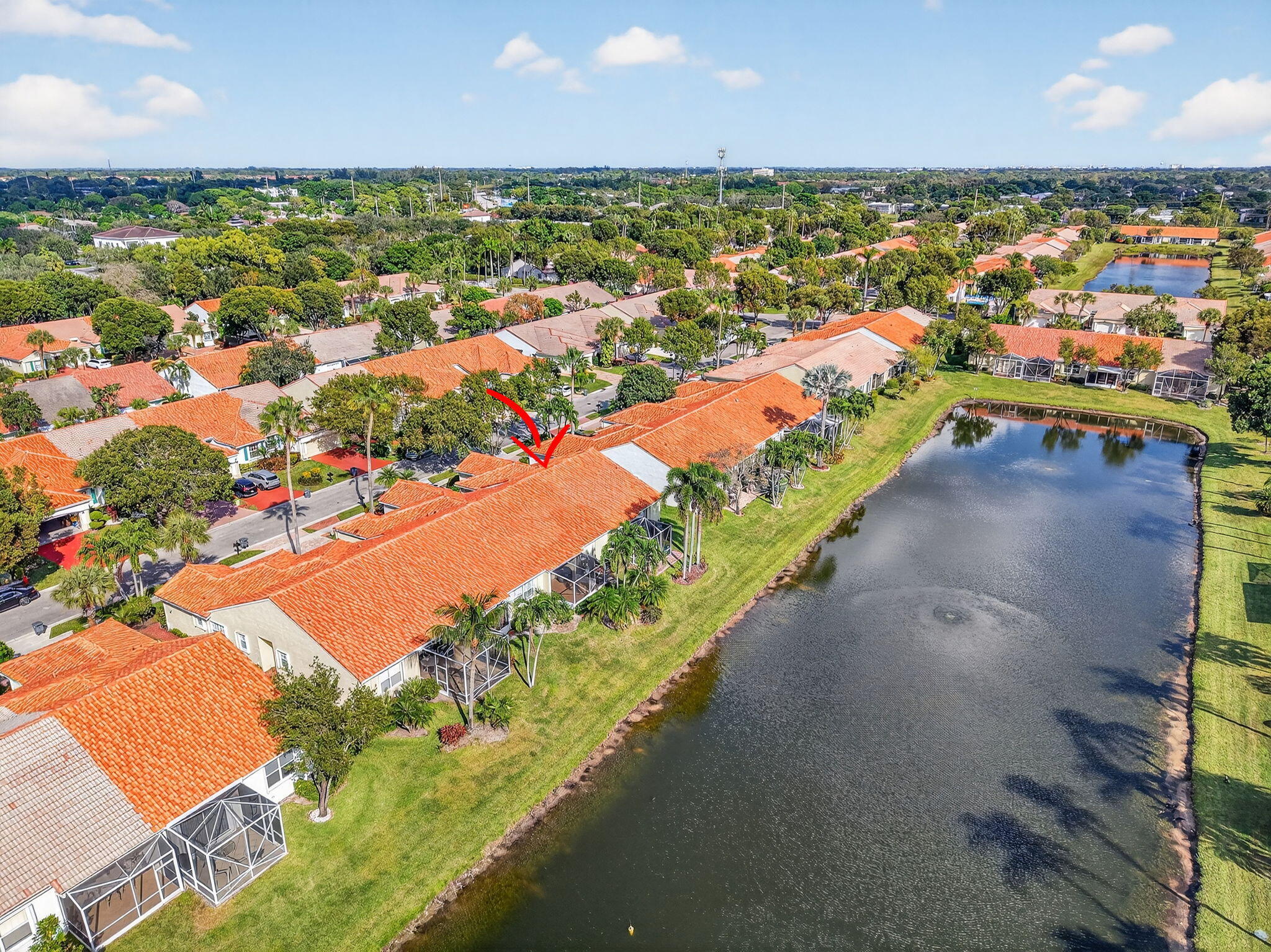 6210 Heliconia Road Delray Beach, FL 33484 - Photo 51 of 53 an aerial view of a city with lots of residential buildings ocean and mountain view in back