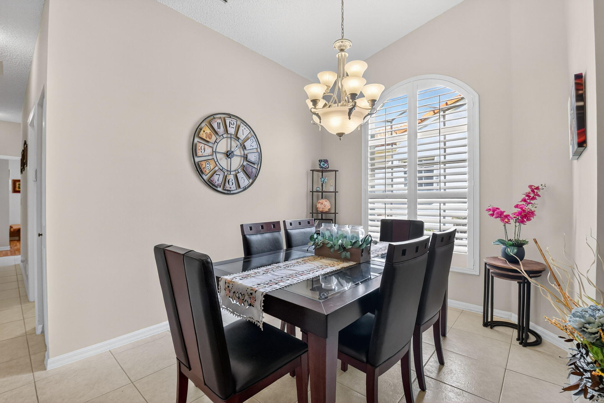 6210 Heliconia Road Delray Beach, FL 33484 - Photo 9 of 53 a view of a dining room with furniture wooden floor and chandelier