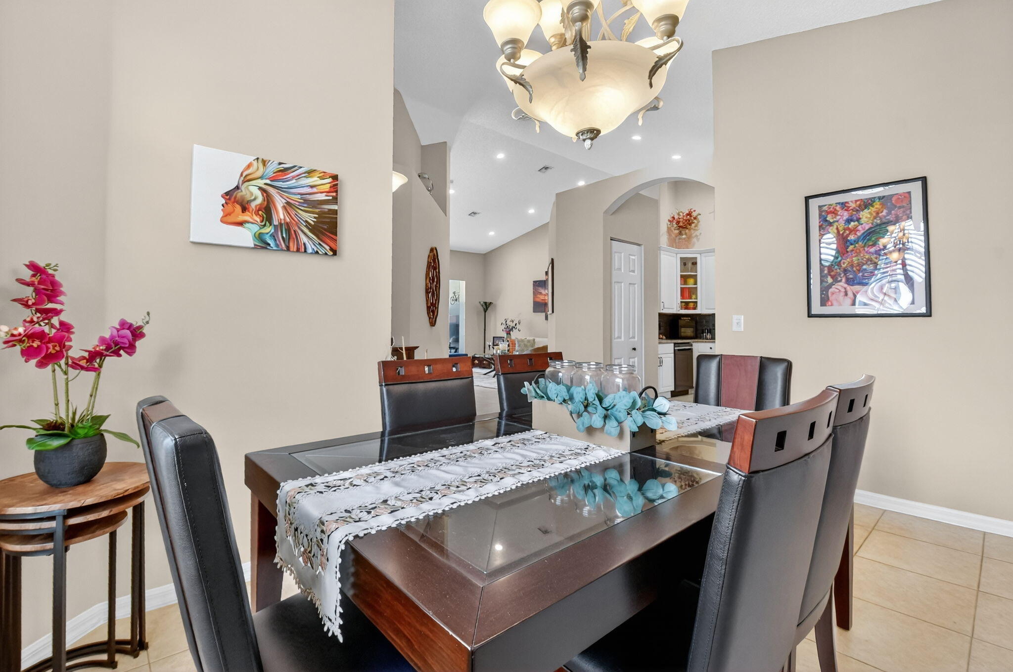 6210 Heliconia Road Delray Beach, FL 33484 - Photo 10 of 53 a view of a dining room with furniture and a chandelier