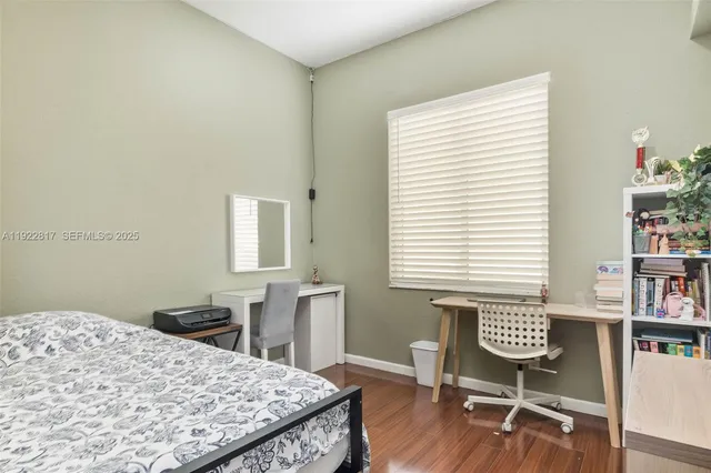 a bedroom with a bed and a table in it