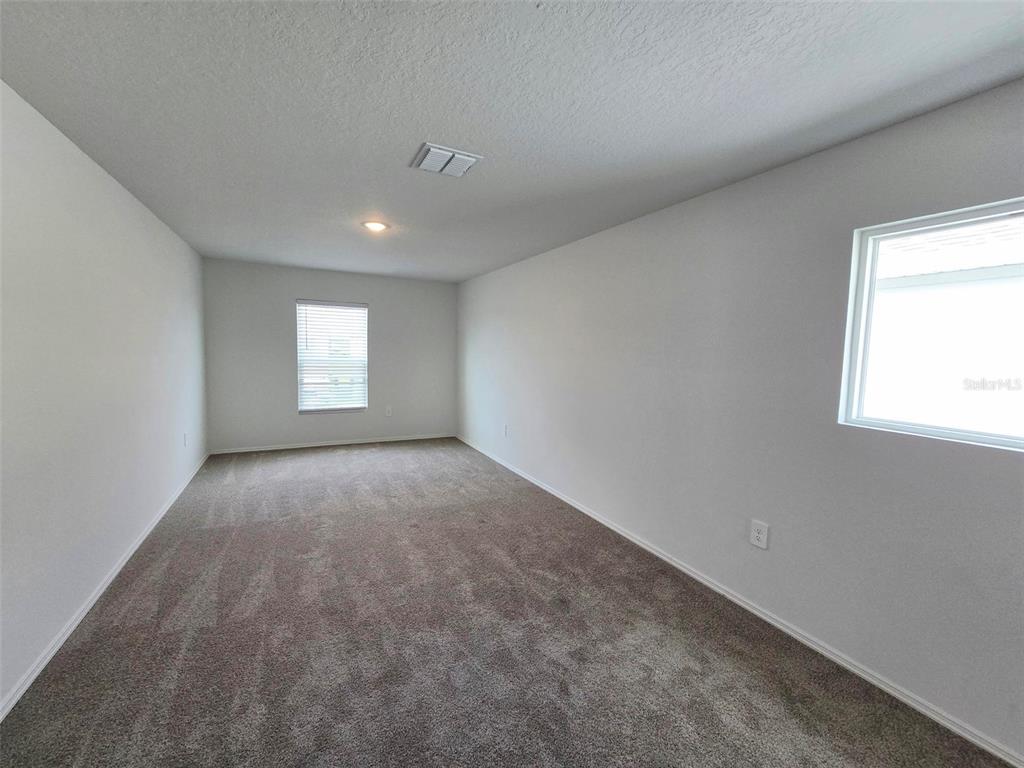 13031 Bluff Oak Way Parrish, FL 34219 - Photo 12 of 25 an empty room with windows