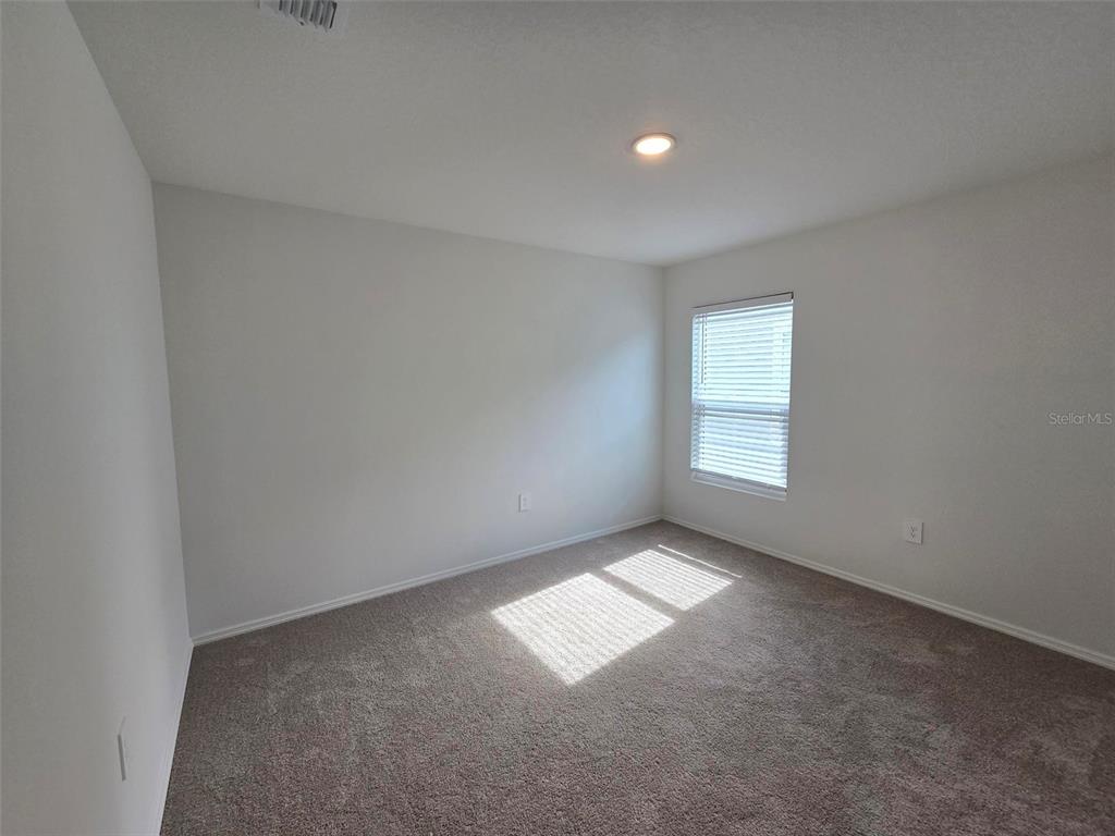 13031 Bluff Oak Way Parrish, FL 34219 - Photo 13 of 25 an empty room with windows