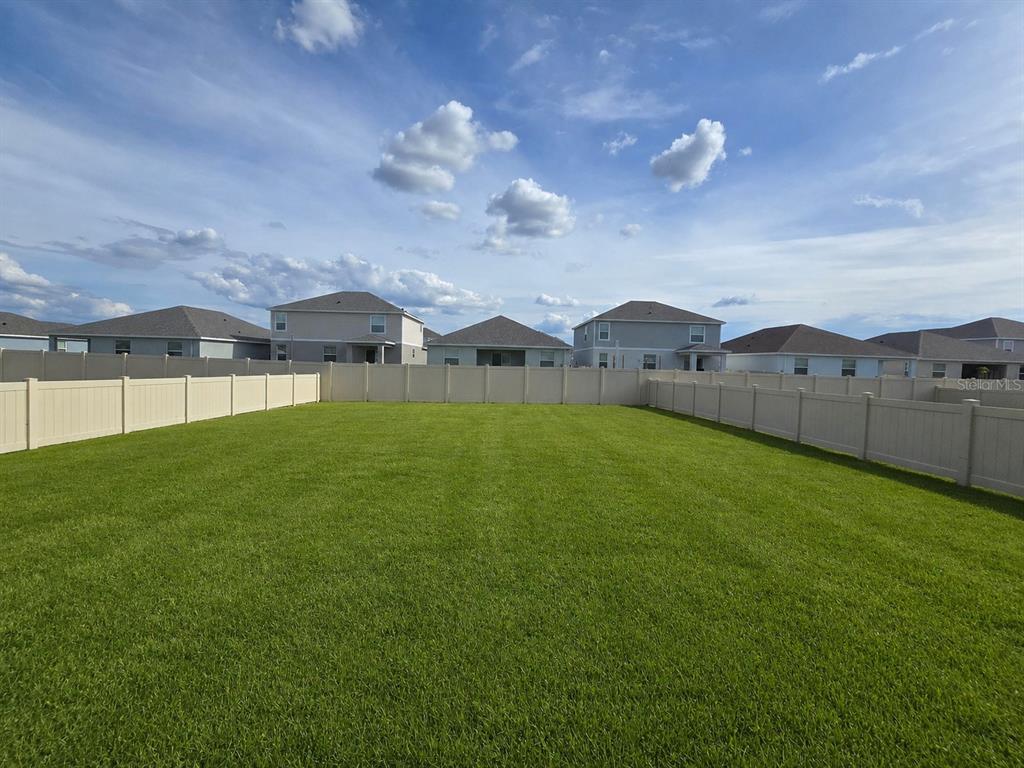 13031 Bluff Oak Way Parrish, FL 34219 - Photo 19 of 25 a view of an house with backyard and garden