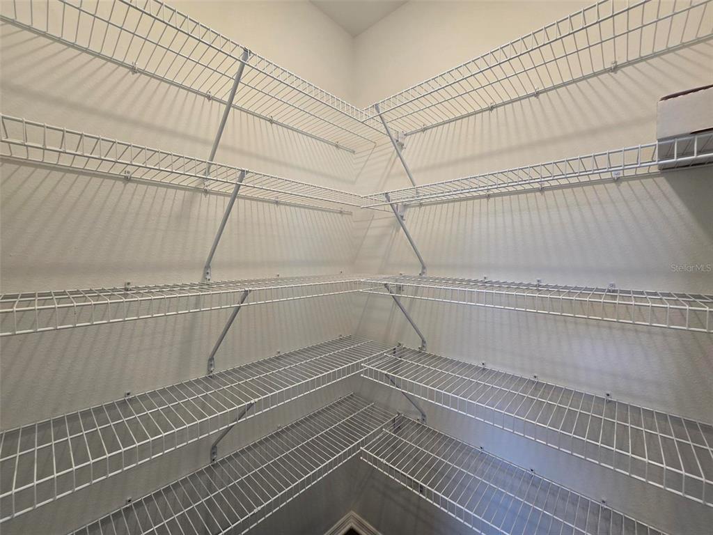 13031 Bluff Oak Way Parrish, FL 34219 - Photo 7 of 25 a view of a room with racks on the wall