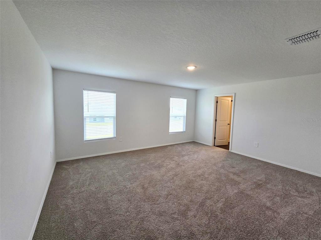 13031 Bluff Oak Way Parrish, FL 34219 - Photo 8 of 25 an empty room with windows