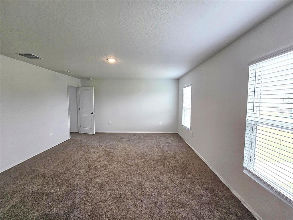 13031 Bluff Oak Way Parrish, FL 34219 - Photo 9 of 25 an empty room with windows
