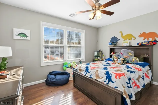 a bed room with bed and window