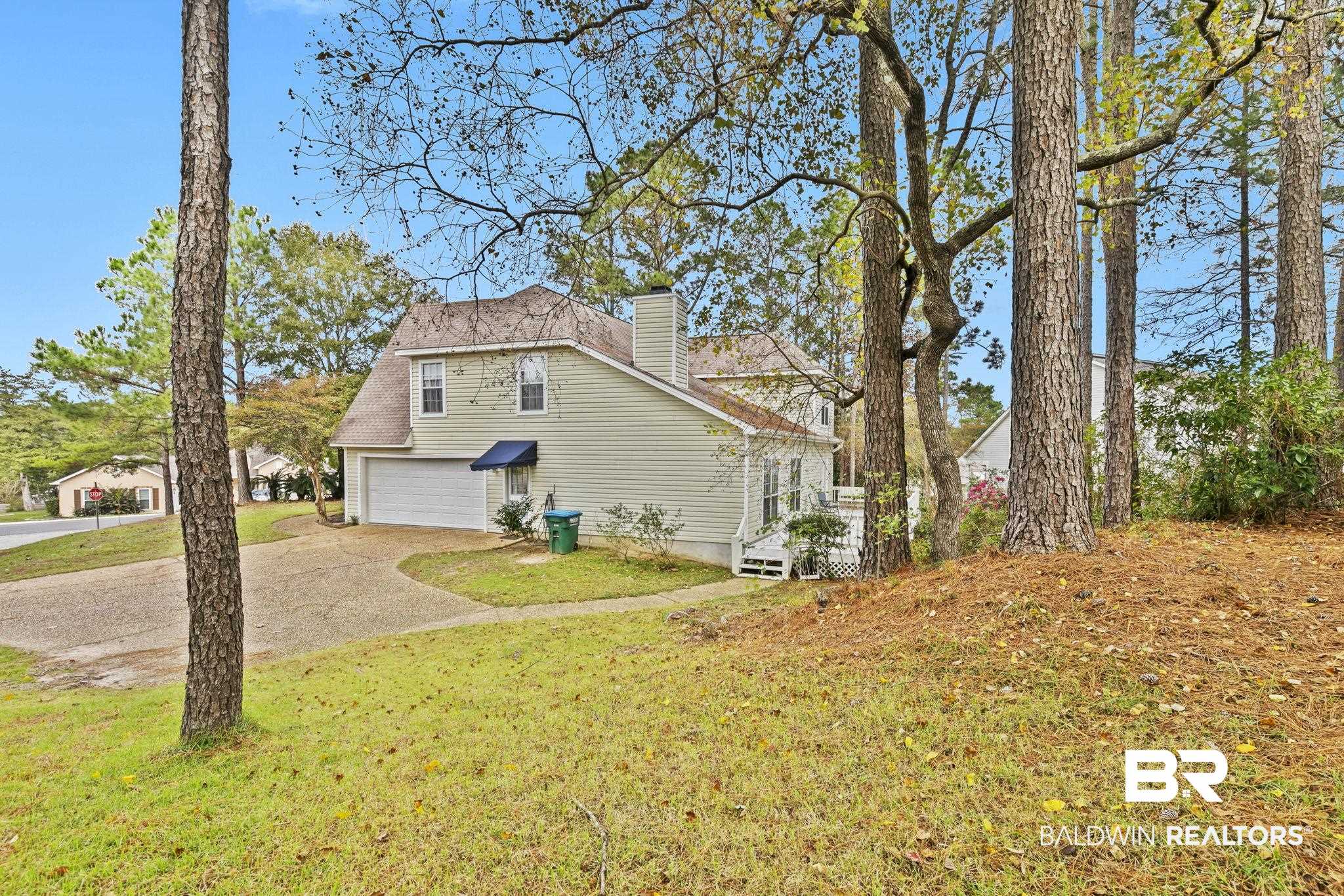 22 Pirates Lane Daphne, AL 36527 - Photo 3 of 36 View of property exterior with a yard and a garage