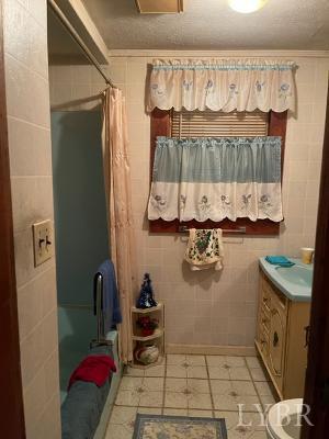1368 Stone Mill Road Hurt, VA 24563 - Photo 11 of 17 a bathroom with a sink and a mirror