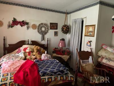 1368 Stone Mill Road Hurt, VA 24563 - Photo 13 of 17 a bedroom with bed and a window