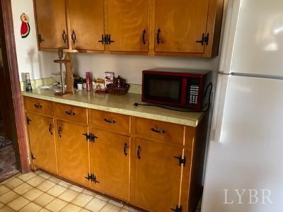 1368 Stone Mill Road Hurt, VA 24563 - Photo 8 of 17 a kitchen with stainless steel appliances a refrigerator and cabinets