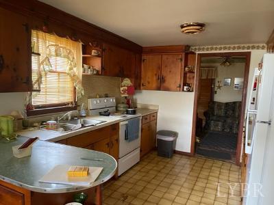 1368 Stone Mill Road Hurt, VA 24563 - Photo 9 of 17 a kitchen with a sink stove and cabinets
