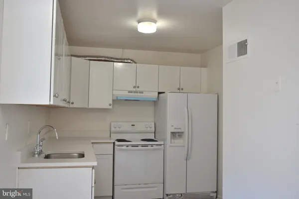a view of a kitchen with cabinets