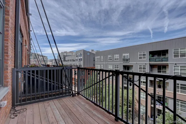 a view of balcony with wooden floor