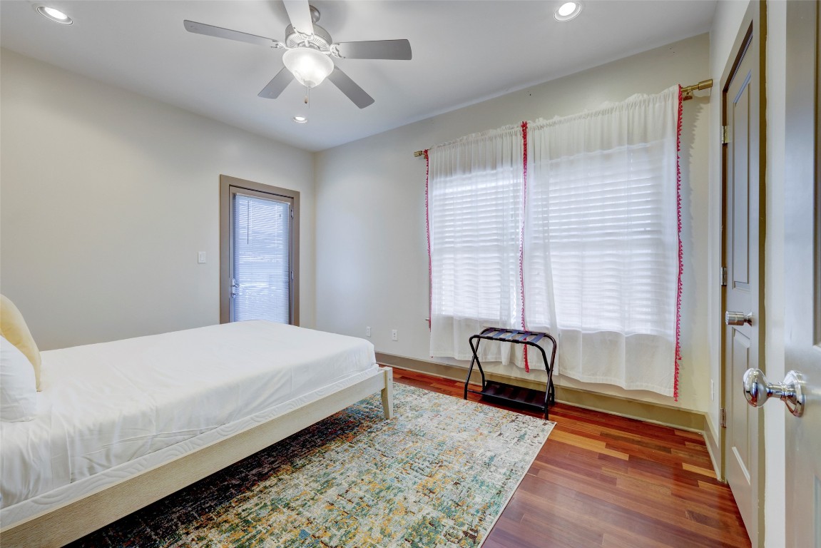 602 West N Loop Boulevard, Unit A AND B Austin, TX 78751 - Photo 13 of 21 a bedroom with a bed and a chandelier
