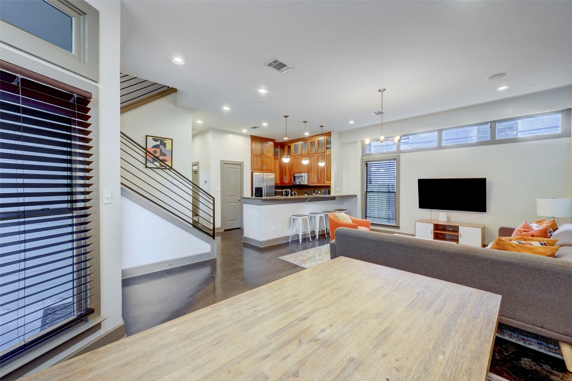 602 West N Loop Boulevard, Unit A AND B Austin, TX 78751 - Photo 5 of 21 a living room with furniture and a flat screen tv
