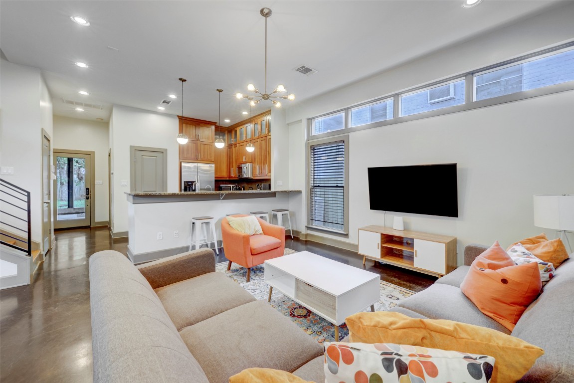 602 West N Loop Boulevard, Unit A AND B Austin, TX 78751 - Photo 6 of 21 a living room with furniture and a flat screen tv