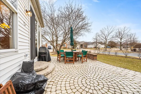 a view of a house with outdoor seating space