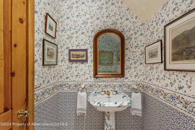 a bedroom with a large bed and a couch