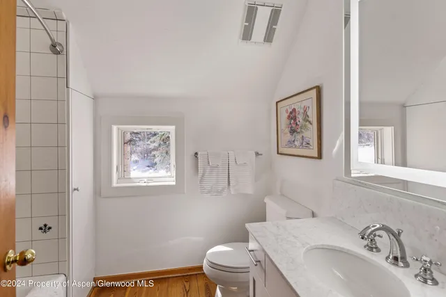 a bathroom with a bathtub and shower