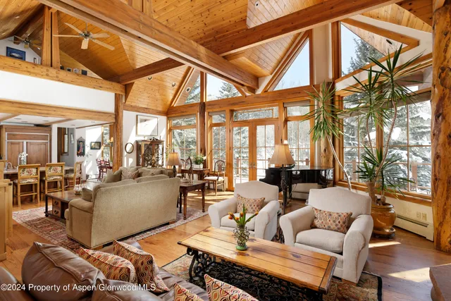 a view of house with backyard outdoor seating and stairs