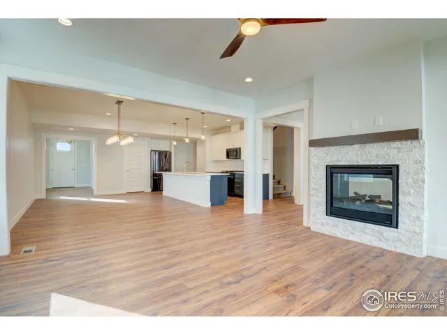 a view interior of a house wooden floor and a fireplace