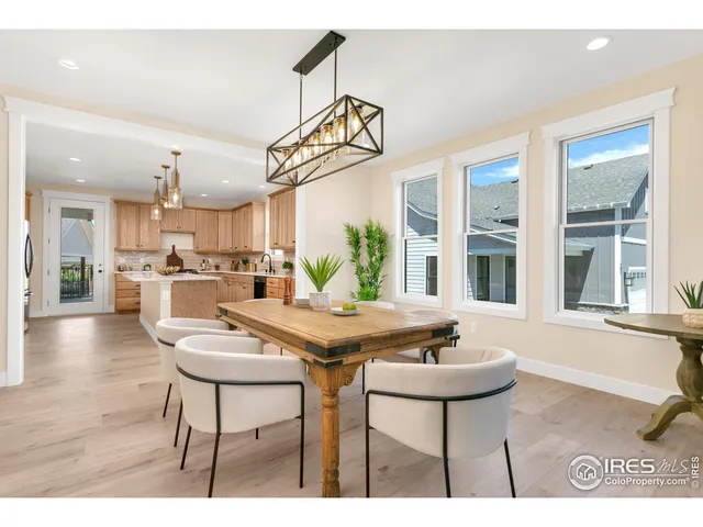 a kitchen with a table and chairs in it