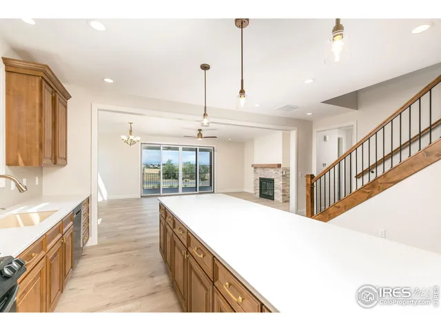 a open kitchen with stainless steel appliances granite countertop a granite counter tops and a view of living room