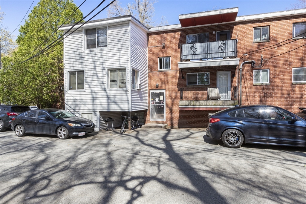 96 Itasca Street, Unit 961 Boston, MA 02126 - Photo 14 of 18 a car parked in front of a house