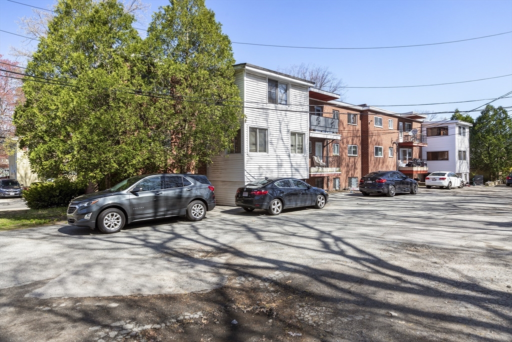 96 Itasca Street, Unit 961 Boston, MA 02126 - Photo 15 of 18 a car parked in front of a building