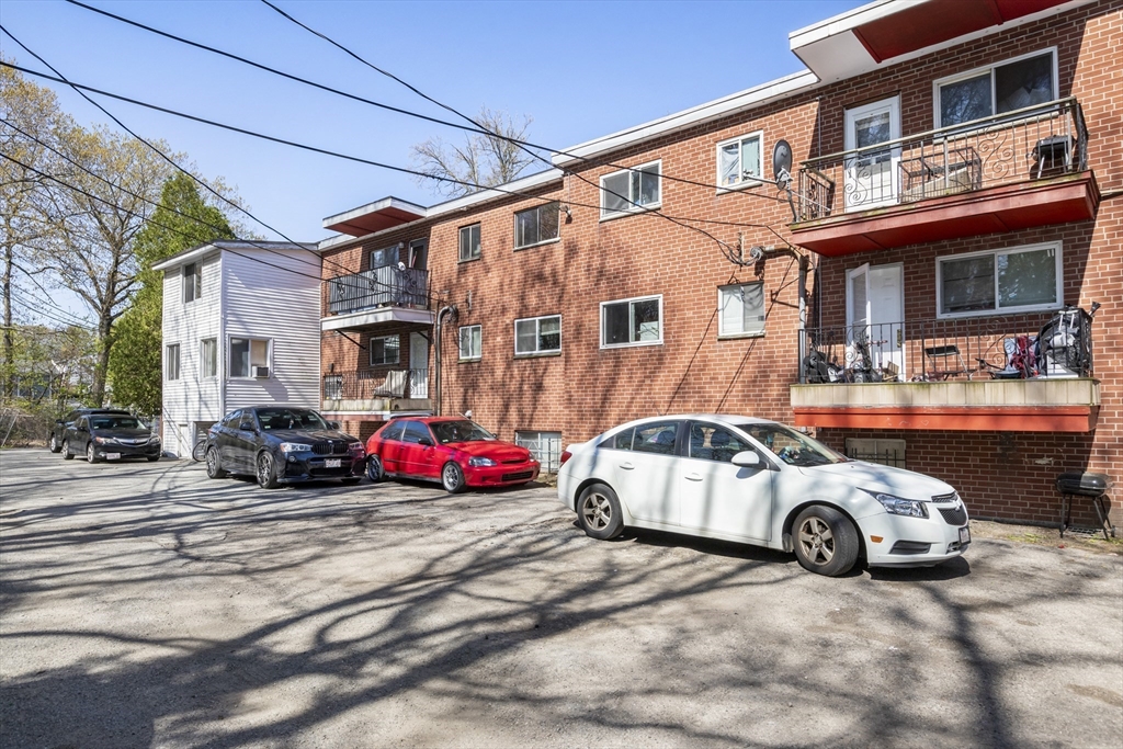 96 Itasca Street, Unit 961 Boston, MA 02126 - Photo 16 of 18 a car parked in front of a building