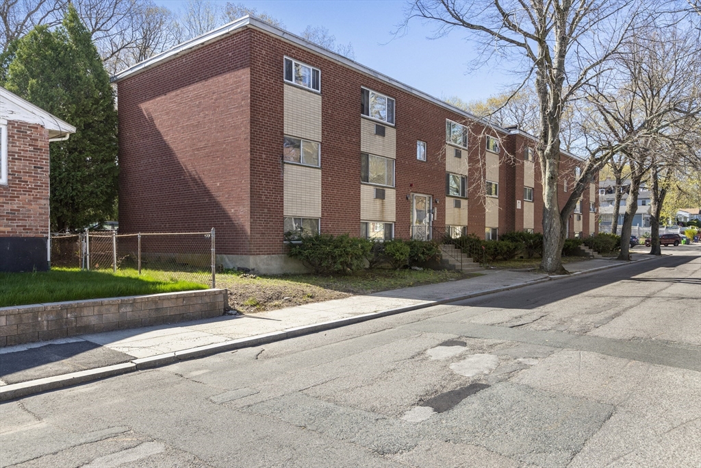 96 Itasca Street, Unit 961 Boston, MA 02126 - Photo 17 of 18 a front view of building with yard