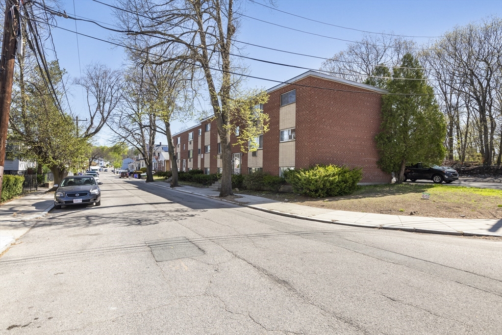 96 Itasca Street, Unit 961 Boston, MA 02126 - Photo 18 of 18 a view of road with large building