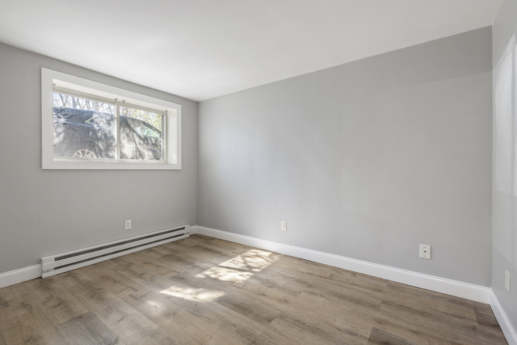 96 Itasca Street, Unit 961 Boston, MA 02126 - Photo 9 of 18 wooden floor in a empty room