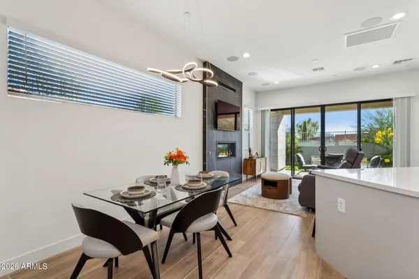a living room with furniture and large windows