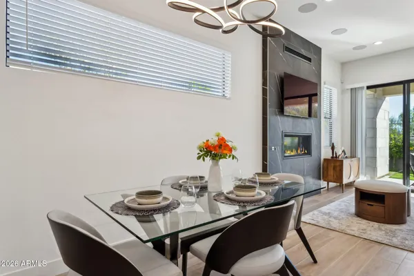 a view of a dining room with furniture and window