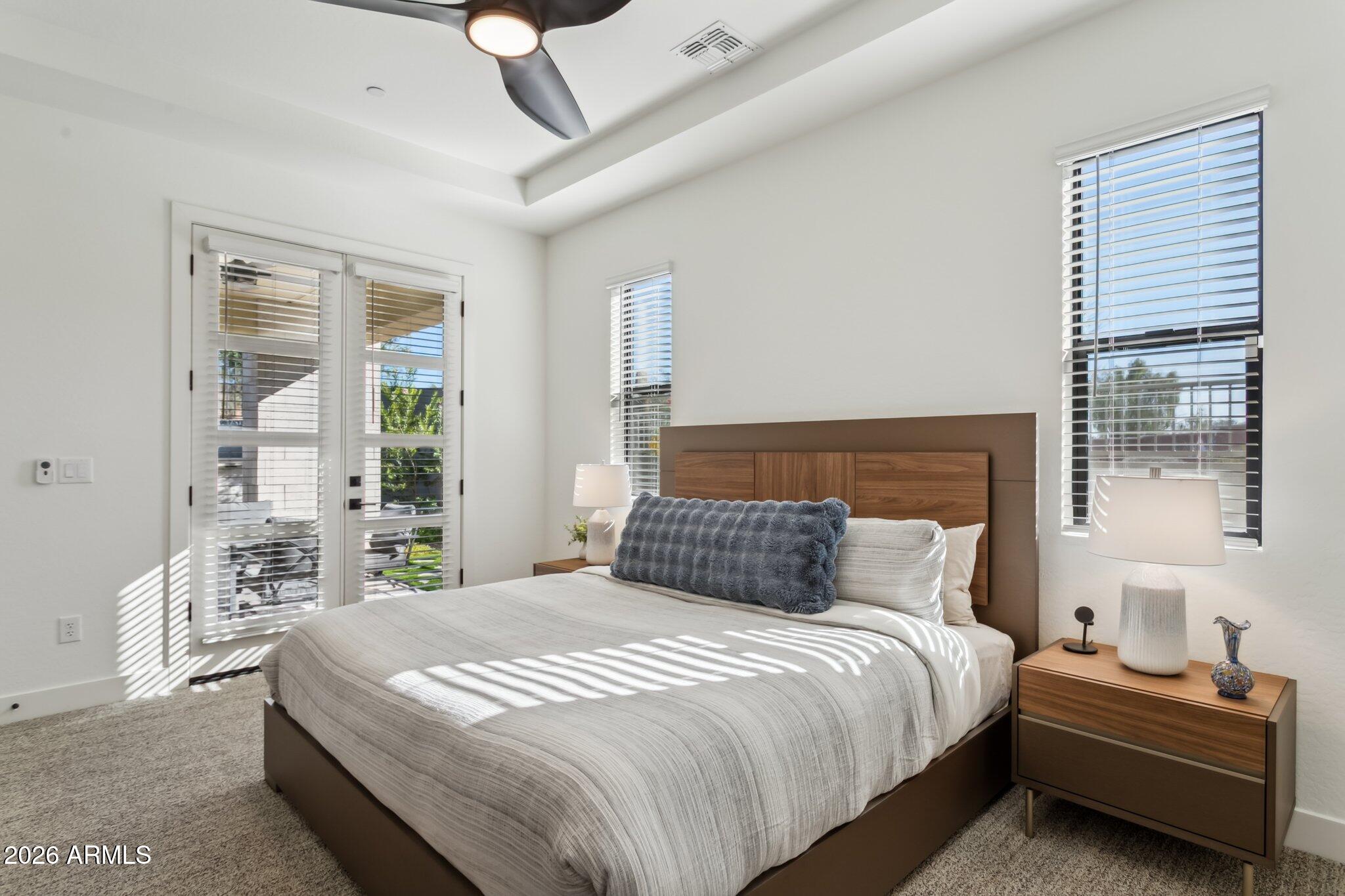 1 Easy Street, Unit 30 Carefree, AZ 85377 - Photo 23 of 70 a bedroom with a bed and a large window