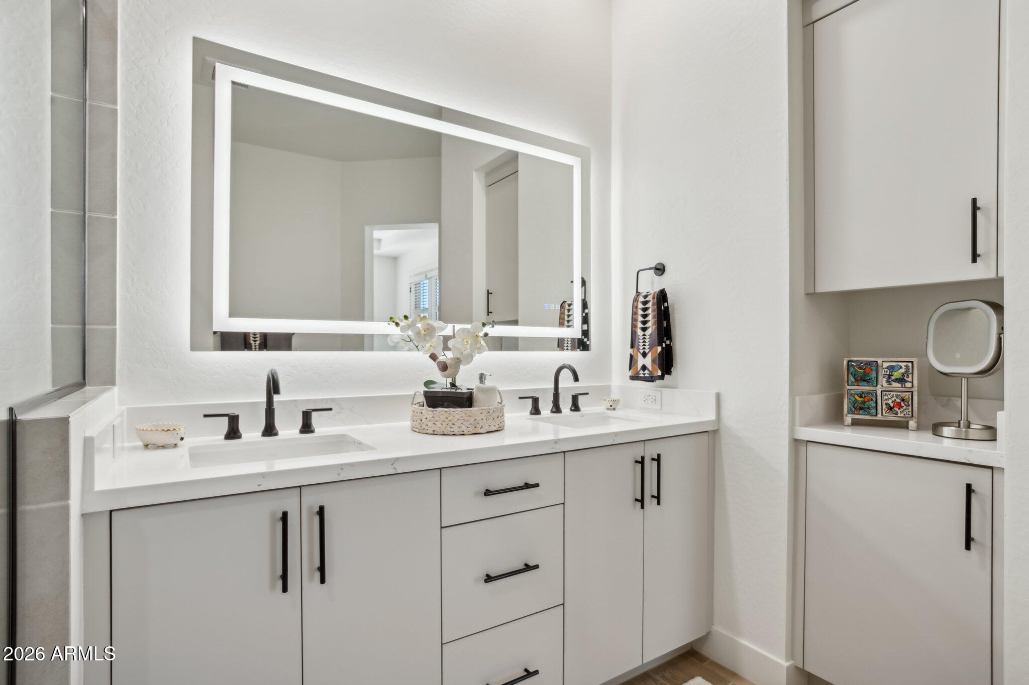 1 Easy Street, Unit 30 Carefree, AZ 85377 - Photo 33 of 70 a bathroom with a sink and a mirror