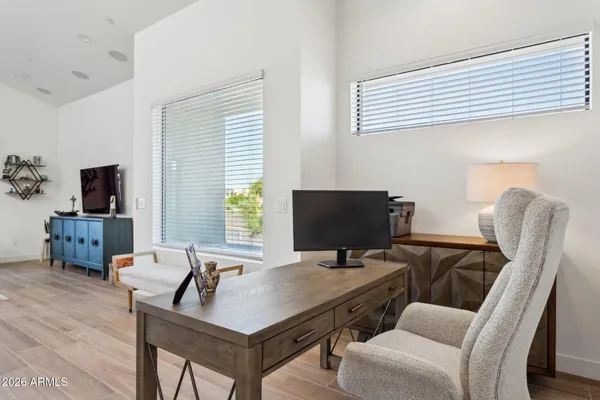 a view of a balcony with furniture and a potted plant