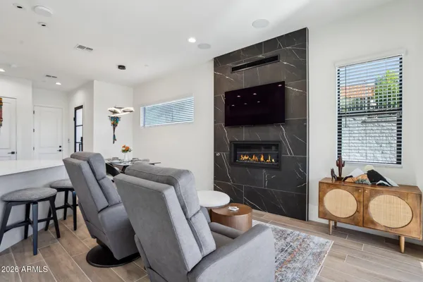a living room with furniture and a fireplace