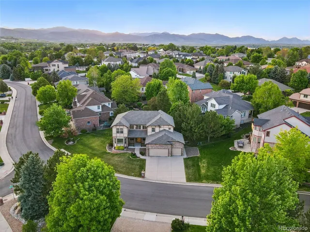an aerial view of a house with mountain view