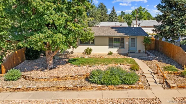 a view of a house with backyard porch and sitting area