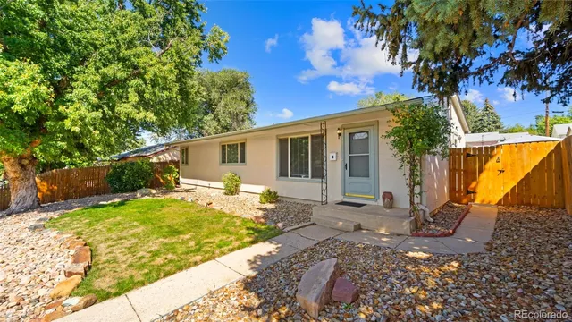 a backyard of a house with seating space