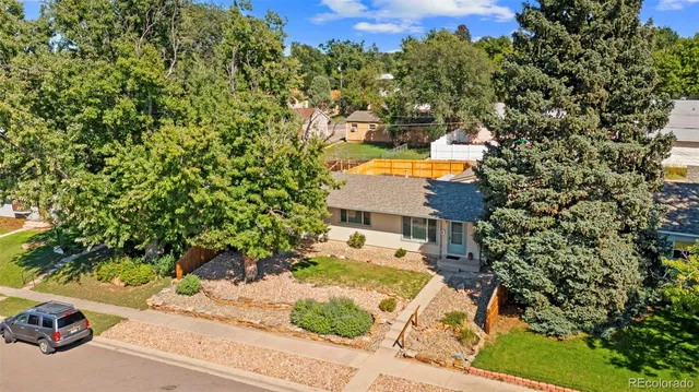 view of balcony with lamp and trees