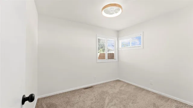 a workspace with furniture bookshelf and a window