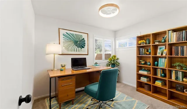 an empty room with wooden floor and window