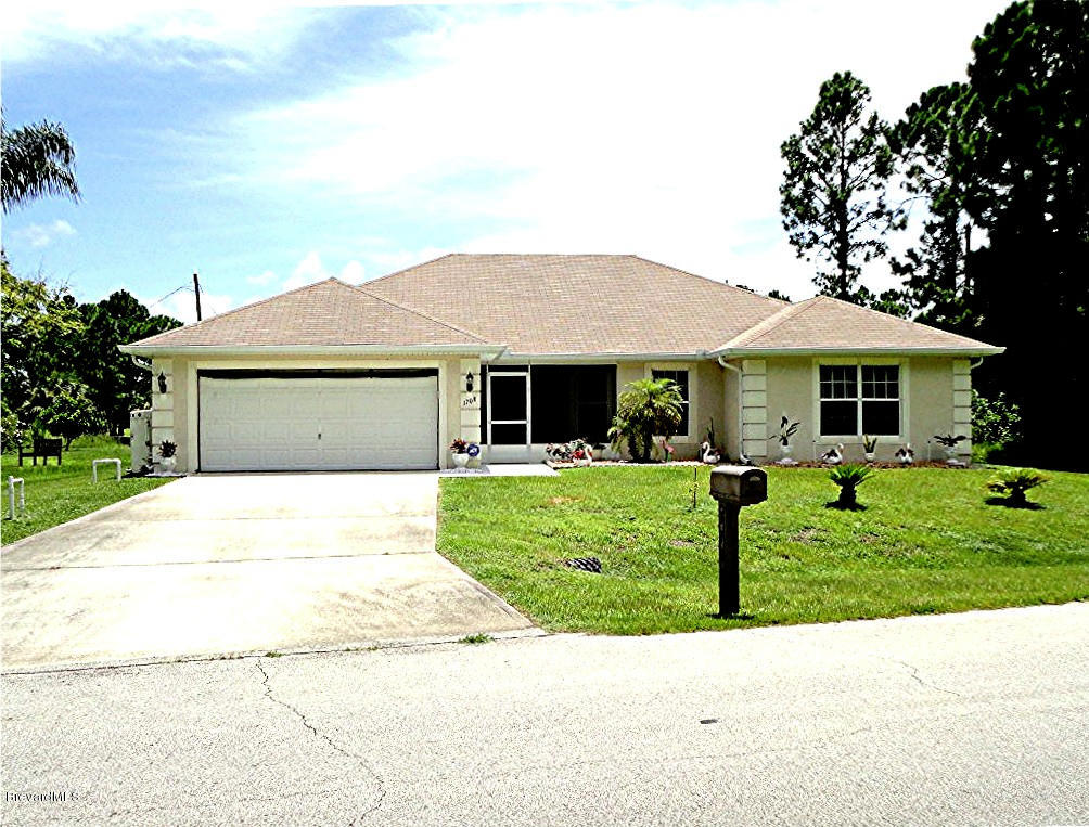 1708 Hydrangea Road Palm Bay, FL 32907 - Photo 1 of 13 Front view
