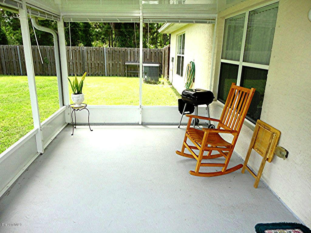 1708 Hydrangea Road Palm Bay, FL 32907 - Photo 4 of 13 Screened patio