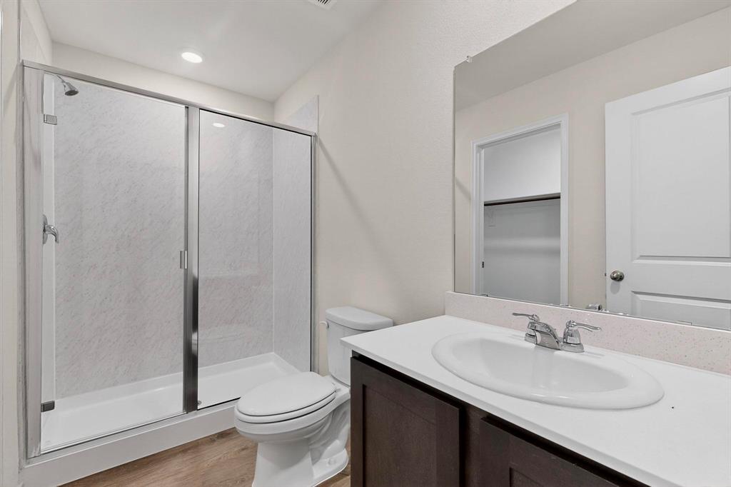 7008 Vining Drive Princeton, TX 75407 - Photo 15 of 34 a bathroom with a sink toilet and shower