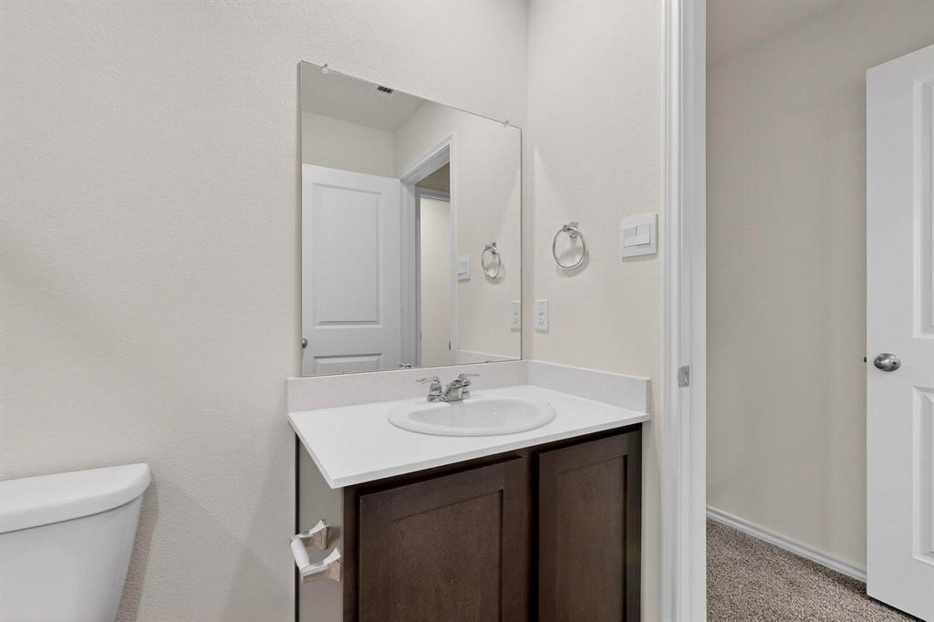 7008 Vining Drive Princeton, TX 75407 - Photo 16 of 34 a bathroom with a sink and a mirror